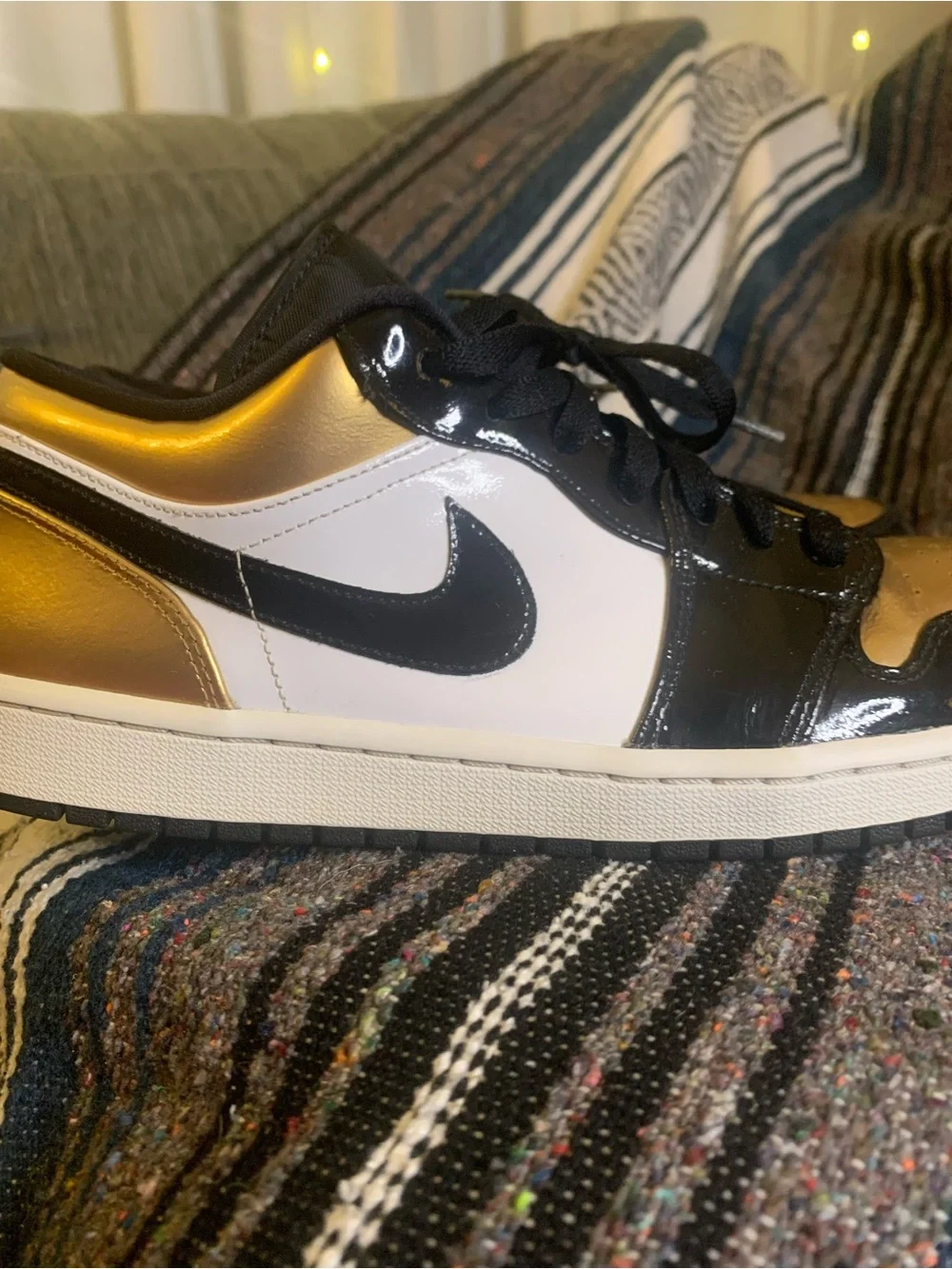 Air Jordan low “Gold Toe” in size 11 men.